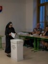 A Catholic nun casts her ballot at a polling station in Bratislava, Slovakia, Sept. 30, 2023.