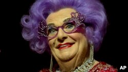 FILE - Australian TV presenter Barry Humphries performing as Dame Edna for the Farewell Tour, at the London Palladium theater in central London, Nov. 13, 2013. (Joel Ryan/Invision/AP)