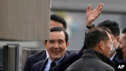 Former Taiwan President Ma Ying-jeou waves as he arrives at the Nanjing Massacre Memorial Hall in Nanjing in eastern China's Jiangsu Province, March 29, 2023. 