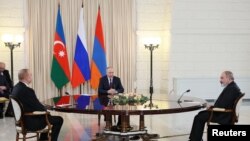 FILE - Russia's President Vladimir Putin, Armenia's Prime Minister Nikol Pashinyan and Azerbaijan's President Ilham Aliyev attend a trilateral meeting in Sochi, Oct. 31, 2022. (Sputnik/Sergey Bobylev/Pool via Reuters) 