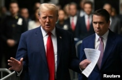 Former U.S. President Donald Trump speaks to the press on arrival at his trial for allegedly covering up hush money payments linked to extramarital affairs, at Manhattan Criminal Court in New York City, May 16, 2024.