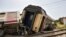 Derailed passenger cars are pictured at the scene of a train accident near Msaken, about 150 km south of the capital in eastern Tunisia, on June 21, 2023. 