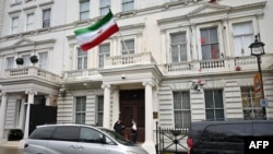 Police officers stand on duty outside the Iranian Embassy in London, Britain, Jan. 14, 2023. 