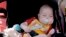 FILE - A baby sleeps July 23, 2023, in St. Joseph, Mo. 