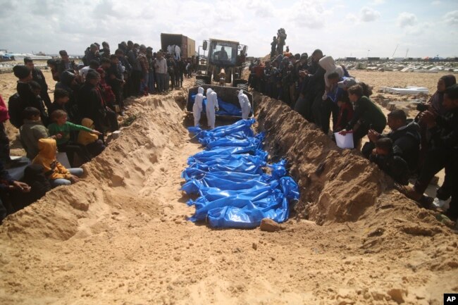 Palestinians attend a mass funeral of people killed in the Israeli offensive on Khan Younis in Rafah, Gaza Strip, March 7, 2024.