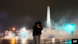 Demonstrator stand in the tear gas during a protest in Paris, Friday, March 17, 2023. 