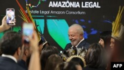 Luiz Inacio Lula da Silva (C), then-Brazil's president-elect, attends a discussion about the Amazon Forest at the COP27 climate conference in Egypt's Red Sea resort city of Sharm el-Sheikh, Nov. 16, 2022.