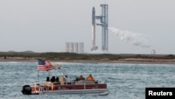 Spectators await the launch of SpaceX's Starship from the company's Boca Chica launchpad near Brownsville, Texas, April 17, 2023. The launch was delayed for at least 48 hours, due to a pressurization issue in a rocket booster