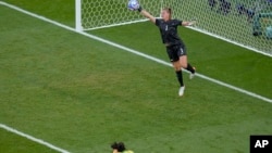 Goalkeeper Alyssa Naeher, of the U.S., right, saves a header by Brazil's Adriana Leal da Silva, right, during the women's soccer gold medal match at the Parc des Princes, Aug. 10, 2024