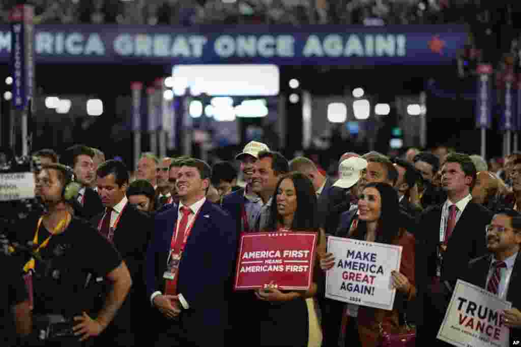 Delegates react while listening to Republican presidential candidate former President Donald Trump speak during the Republican National Convention, July 18, 2024, in Milwaukee.