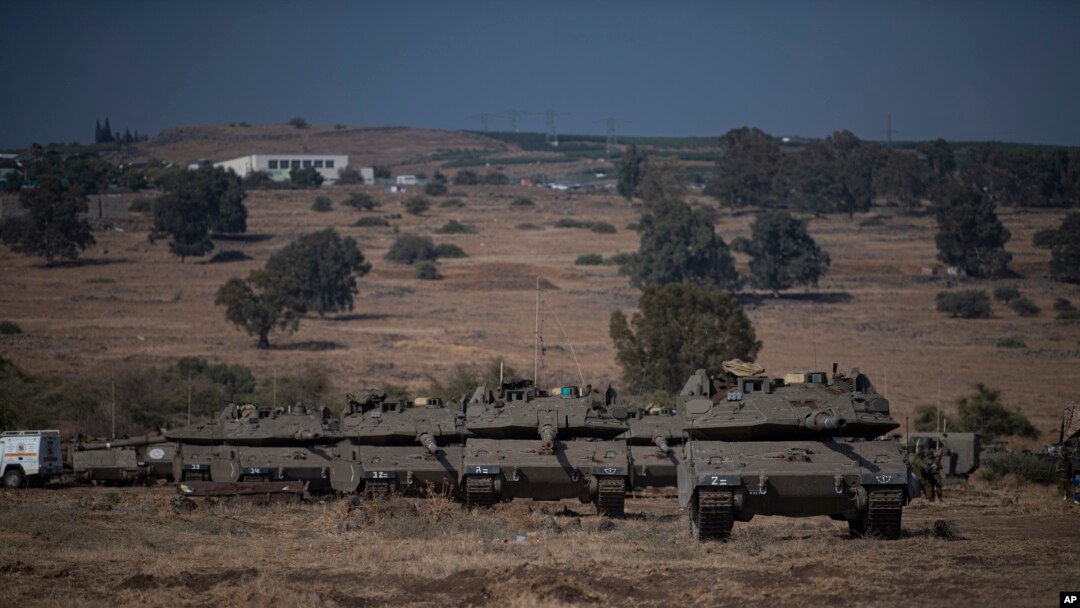 Israeli tanks are seen near the border with Lebanon, Oct. 10, 2023.
