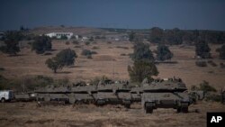 Israeli tanks are seen near the border with Lebanon, Oct. 10, 2023.
