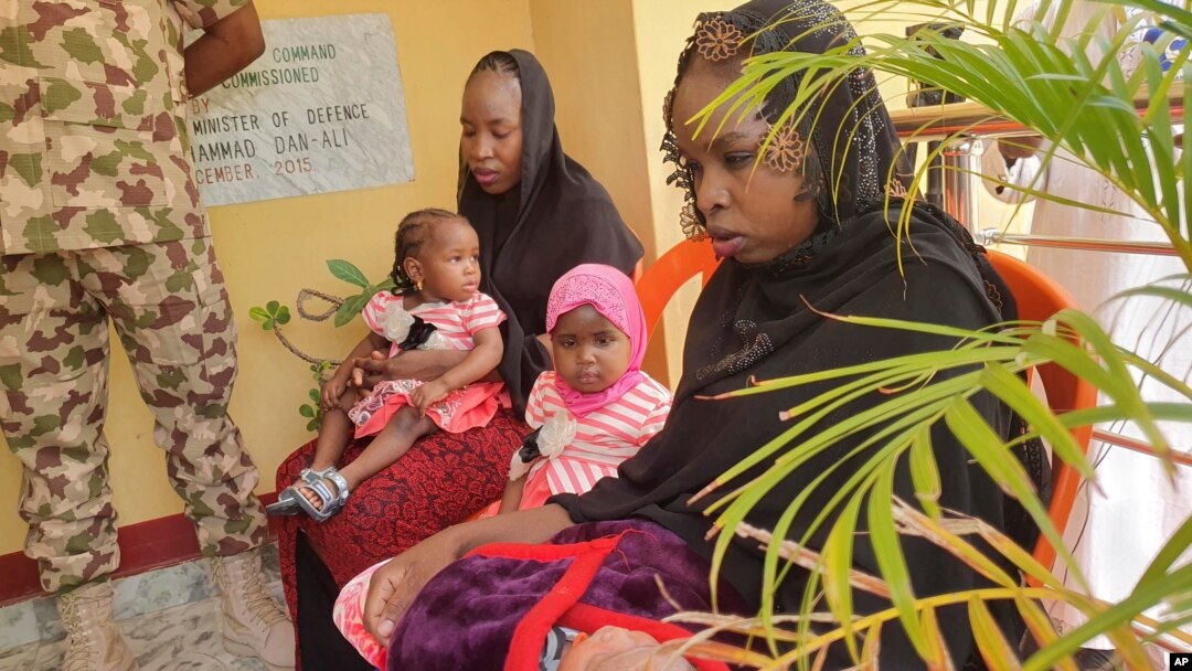 Recently freed Chibok schoolgirls, now 26 years old, with their children are photographed at the Army Maimalari Cantonment in Maiduguri, Nigeria, May 4, 2023. 