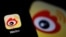 FILE - The logo of Chinese social media app Weibo is seen on a mobile phone, Dec. 7, 2021.