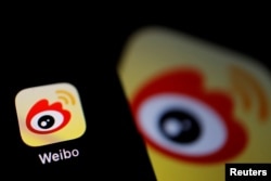 The logo of Chinese social media app Weibo is seen on a mobile phone in this illustration picture taken Dec. 7, 2021.