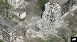 This photo taken from a drone video provided by Ukraine Patrol Police, shows devastation in Chasiv Yar, an eastern Ukrainian city Russia is assaulting, Ukraine, April 29, 2024.