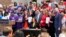 FILE - Michigan Gov. Gretchen Whitmer signs legislation in Royal Oak, Michigan, May 22, 2023. Fueled by election gains, Democrats in Minnesota and Michigan this year enacted far-reaching policy changes that party leaders aspire to replicate elsewhere.