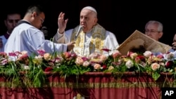 Pope Francis bestows the plenary 'Urbi et Orbi' (to the city and to the world) blessing from the central lodge of the St. Peter's Basilica at the Vatican at the end of the Easter Sunday Mass, April 9, 2023. 