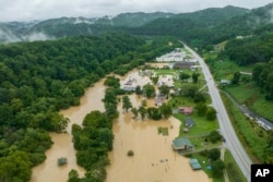 FILE - Homes and structures are flooded near Quicksand, Ky., July 28, 2022. (Ryan C. Hermens/Lexington Herald-Leader via AP, File)