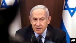 FILE - Israeli Prime Minister Benjamin Netanyahu chairs a weekly cabinet meeting at his office in Jerusalem, Aug. 27, 2023. Netanyahu arrived in the U.S. Sept. 18, 2023, for a meeting later in the week with President Joe Biden.