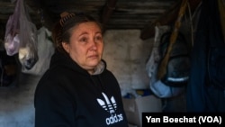 Galina, in New York, Ukraine, on Feb. 20, 2023, says she hoped that changing their city's name would bring a better future, but now she feels abandoned by everyone.