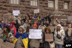 Activists attend a rally in front of Kyiv City Council, demanding from the local authorities to allocate more budget funds to the needs of the Armed Forces of Ukraine, in downtown Kyiv, on December 16, 2023, amid the Russian invasion of Ukraine.
