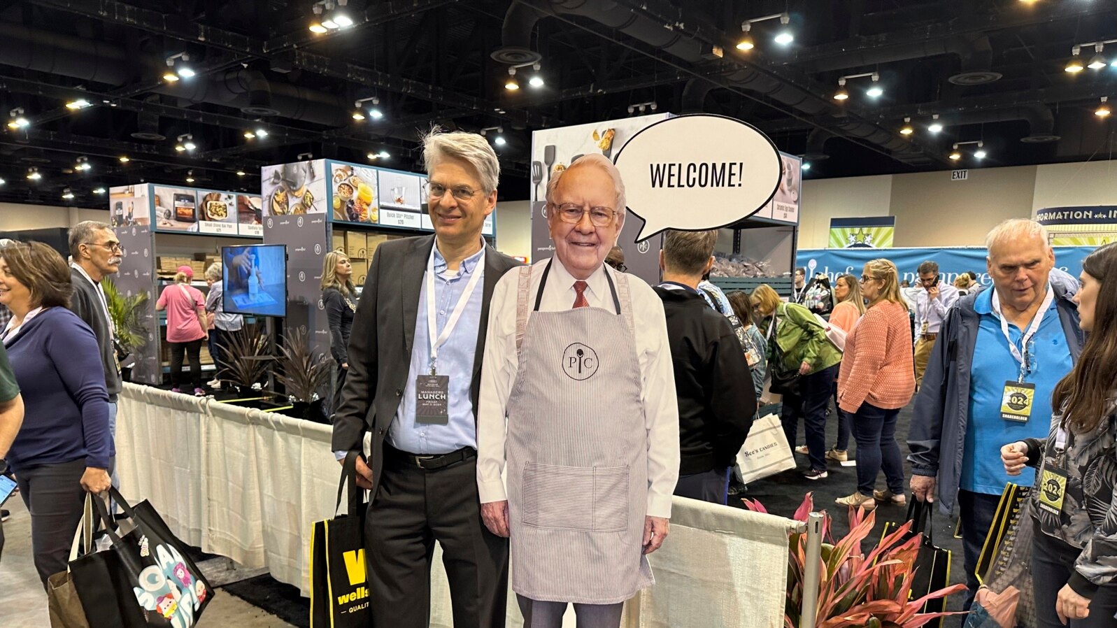 Berkshire Hathaway shareholders pose with a cutout poster of CEO Warren Buffett in Omaha, Nebraska, May 3, 2024. 