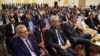 FILE - Aidan O'Hara, left, E.U. ambassador to Sudan, attends the signing ceremony of an initial deal between military and civilian leaders in Khartoum, Sudan, on Dec. 5, 2022. 