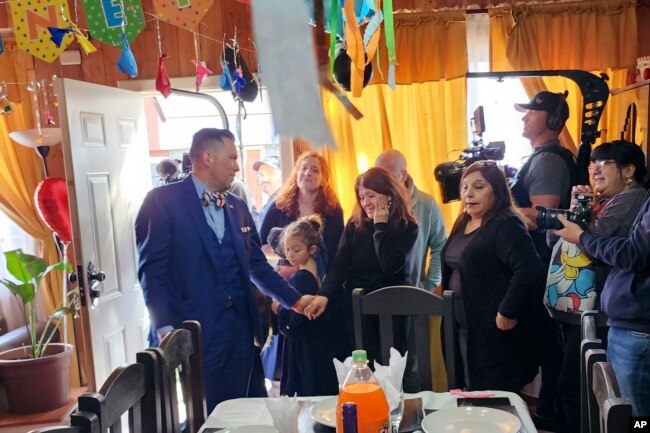 Jimmy Thyden, left, holds hands with Maria Angelica Gonzalez, his Chilean birth mother, as they meet in Valdivia, Chile on Thursday, Aug. 17, 2023, for the first time. (Constanza Del Rio/Nos Buscamos via AP)