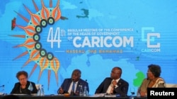 Dr. Carla Barnett, secretary-general of The Caribbean Community (CARICOM), the Bahamas' Prime Minister Philip Davis, Dominica's Prime Minister Roosevelt Skerrit, and Barbados' Prime Minister Mia Mottley attend CARICOM, in Nassau, Bahamas, Feb. 17, 2023.