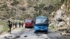 Security personnel inspect the site of a suicide attack near Besham city in the Shangla district of Khyber Pakhtunkhwa province on March 26, 2024.