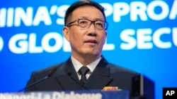 FILE - China's Defense Minister Dong Jun speaks during the 21st Shangri-La Dialogue summit at the Shangri-La Hotel in Singapore, June 2, 2024. The Financial Times reports that Chinese Defense Minister Dong Jun is under investigation for corruption.