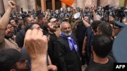 Demonstrators, including protest leader Archbishop Bagrat Galstanyan, rally to demand Armenian Prime Minister Nikol Pashinyan's resignation, outside the government building in central Yerevan, May 30, 2024. 