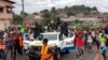 FILE - This image taken from video shows coup supporters cheering police officers in Libreville, Gabon, on Aug. 30, 2023.