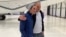This handout photo released by Blandine Briere shows French-Irish citizen Bernard Phelan, right, and French citizen Benjamin Briere upon their arrival at Le Bourget Airport near Paris on May 12 after their release from Iran. (AFP PHOTO/BRIERE FAMILY )