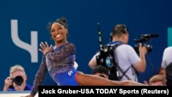 FILE - Simone Biles of the United States competes on the floor exercise in the women’s gymnastics all-around during the Paris 2024 Olympic Summer Games at Bercy Arena in Paris, Aug. 1, 2024.