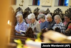 Sisters sing during evening prayer at Mount St. Scholastica Benedictine Monastery in Atchison, Kansas, Tuesday, July 16, 2024. (AP Photo/Jessie Wardarski)