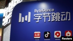 FILE - The logo of TikTok's parent company ByteDance is seen at its booth during an organized media tour to the Zhongguancun National Innovation Demonstration Zone Exhibition Center in Beijing, Feb. 10, 2022.