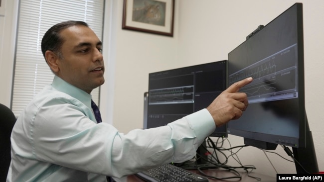 Dr. Roneil Malkani shows an example of pink noise being used to enhance slow brainwaves during deep sleep, May 16, 2024. (AP Photo/Laura Bargfeld)
