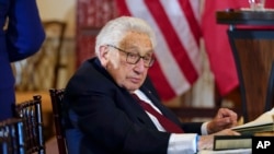 FILE - Former U.S. Secretary of State Henry Kissinger attends a luncheon, Dec. 1, 2022, at the State Department in Washington.
