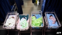 FILE - Newborn babies sleep in cots at a maternity center in Lagos, Nigeria, on Oct. 14, 2022. 