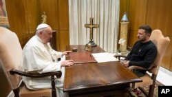 Photo from the Vatican News shows Pope Francis meeting Ukrainian President Volodymyr Zelenskyy during a private audience at the Vatican, May 13, 2023.