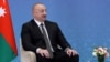 FILE - Azeri President Ilham Aliyev attends a meeting with Russian President Vladimir Putin in Astana, Kazakhstan, July 3, 2024. Aliyev pledged Saturday to help France's overseas territories secure independence.