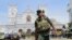 FILE- In this Apr. 21, 2019 file photo, Sri Lankan army soldiers secure the area around St. Anthony's Shrine after a blast on Easter Sunday in Colombo, Sri Lanka. 