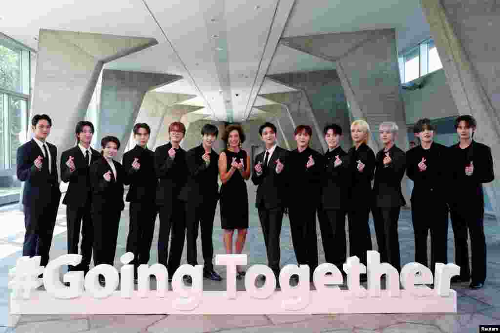 UNESCO Director-General Audrey Azoulay and members of South Korean boy band SEVENTEEN pose during a photocall before their nomination ceremony as Goodwill Ambassador for Youth at the UNESCO headquarters in Paris, France.