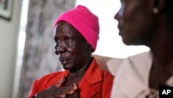 FILE - Adeng Ajang of South Sudan, talks about her two granddaughters still in Africa during an interview at her son's home Wednesday, Nov. 8, 2023, in Haslet, Texas.