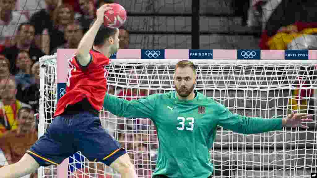 Spain's Daniel Fernandez shoots on goal during a semifinal handball match between Germany and Spain at the 2024 Summer Olympics in Villeneuve-d'Ascq, France.