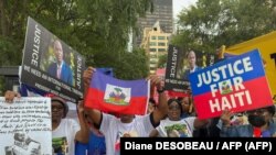 Apoiantes do presidente haitiano assassinado, Jovenel Moïse, realizam um comício em frente à sede das Nações Unidas em Nova Iorque, 22 de setembro de 2023.