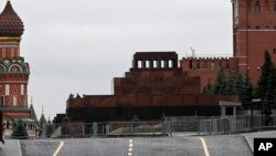 Servicemen stand on a tribune of Lenin mausoleum closed due to security reasons, Red Square in Moscow, Russia, June 24, 2023