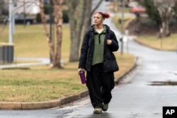 Kailani Taylor-Cribb walks through her neighborhood in Asheville, N.C., on Tuesday, Jan. 31, 2023. (AP Photo/Kathy Kmonicek)